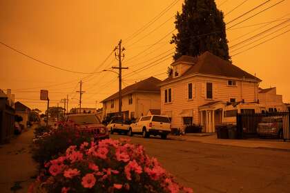 The sky glows a yellow-orange color due to multiple wildfires burning across California and Oregon as the sun rises over San Francisco, Calif. Wednesday, September 9, 2020.