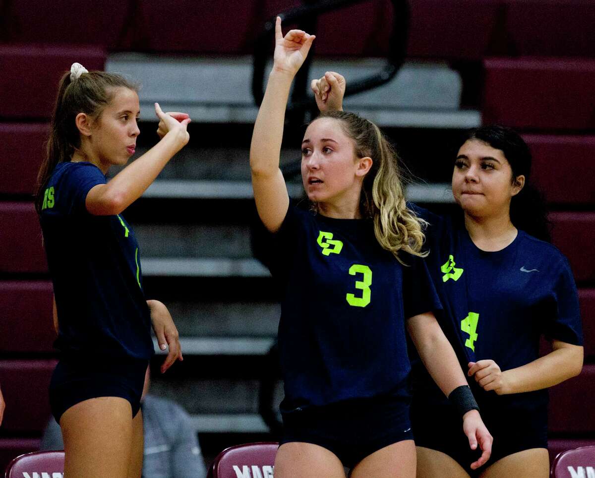 College Park defensive specialist Alexis McDaniel (3) signals for match point in the fourth set of a non-district high school volleyball match, Friday, Aug. 23, 2019, in Magnolia.