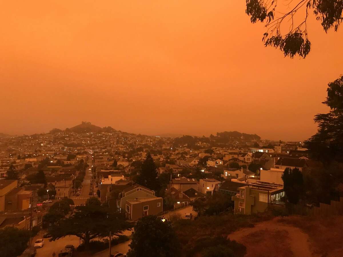 San Francisco is unrecognizeable as seen from Billy Goat Hill Park, bathed in the yellow/orange pallor of wildland fire smoke-choked skies on Wednesday, Sept. 9, 2020. Smoke from multiple wildland fires buring in California and neighboring states is fouling the sky, blotting out the sun.