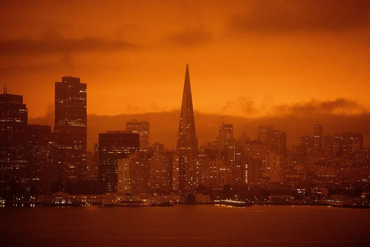 Dark orange skies hang over the San Francisco skyline seen from Treasure Island in San Francisco, Calif. Wednesday, September 9, 2020 due to multiple wildfires burning across California and Oregon.