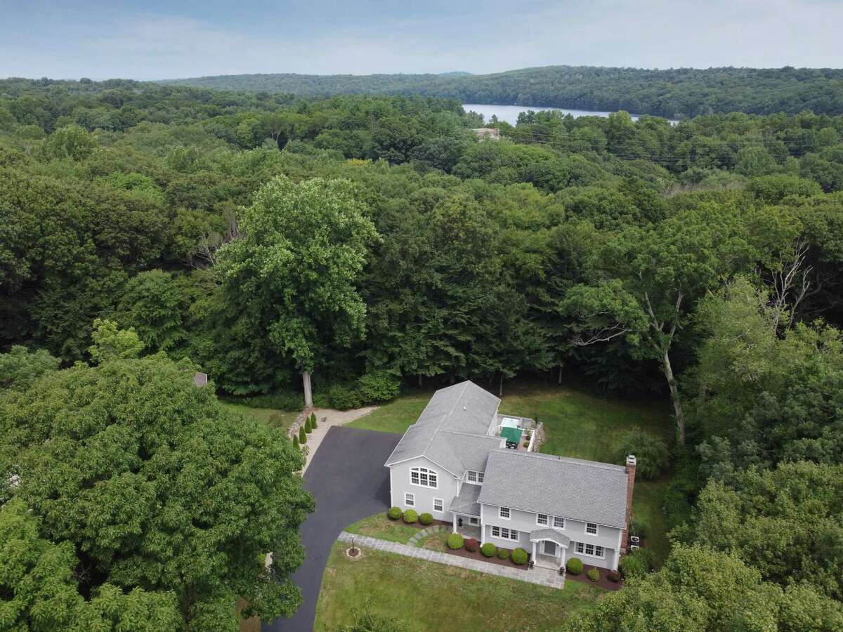 This house sits in a very private setting in Greenfield Hill yet not far from the Merritt Parkway, Black Rock Turnpike shopping and dining, Burr Elementary School, and the Connecticut Audubon Center.