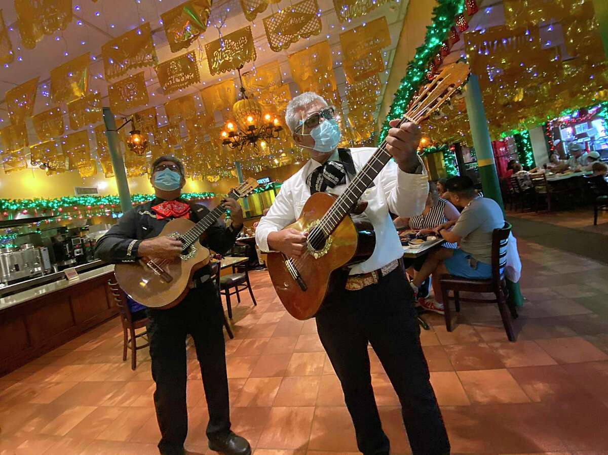 Mariachis are part of the experience when you order pizza from the Zapata's Pizza menu at Mi Tierra Cafe y Panadería.