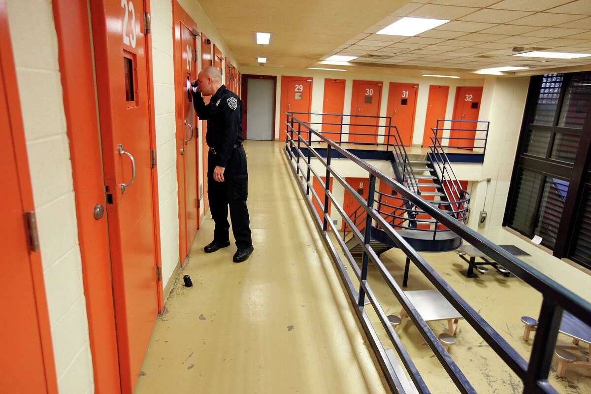 File photo of a deputy making checks on inmates at the Bexar County Adult Detention Center.