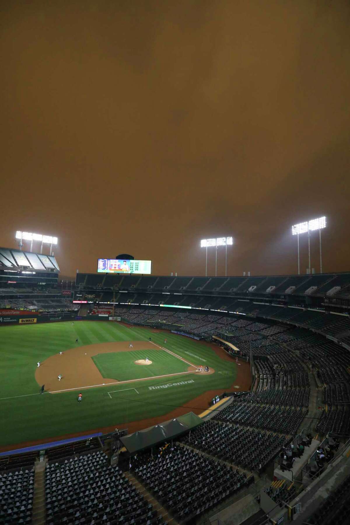Photos that make you wonder how Astros, A's played a baseball game