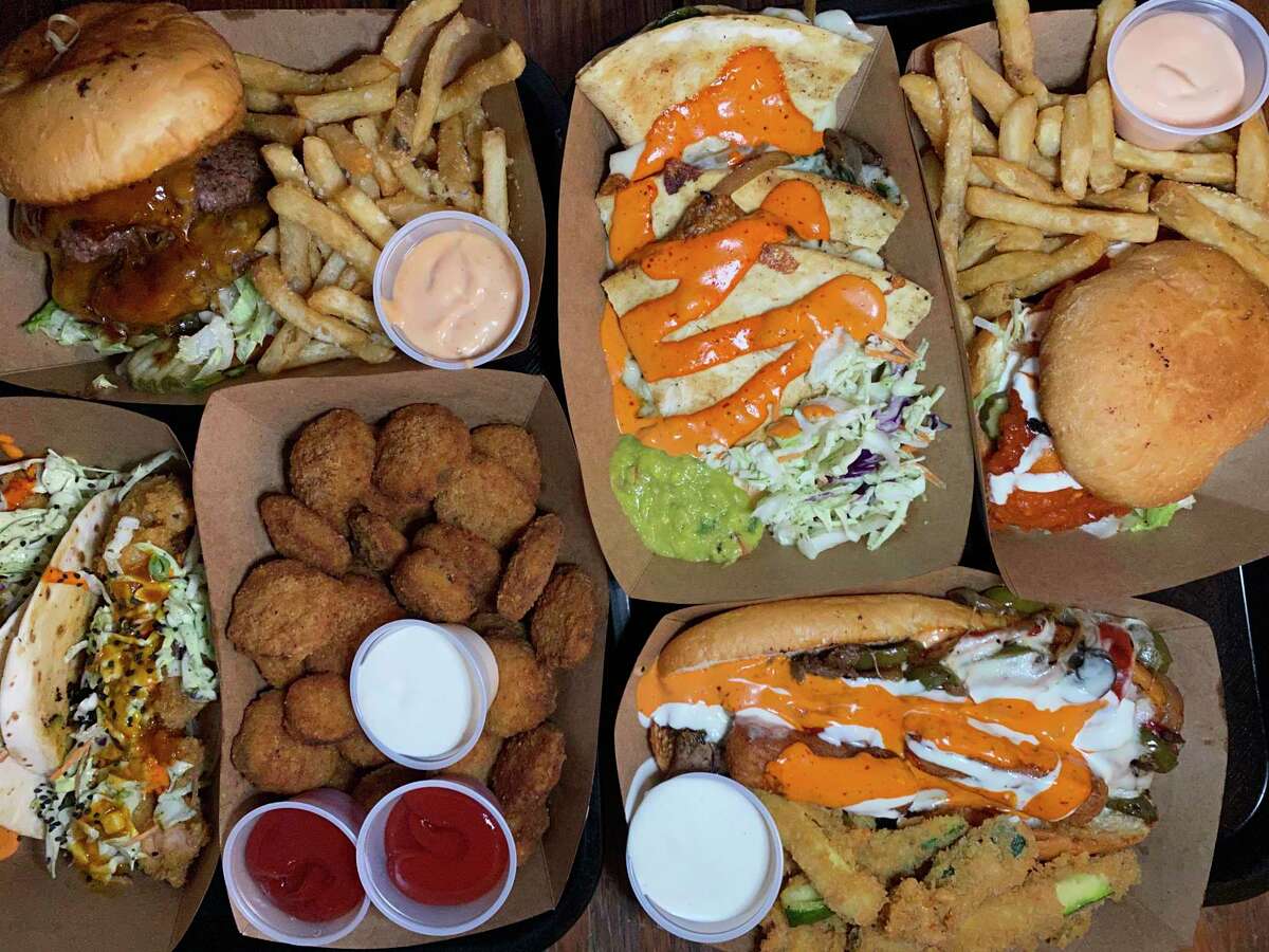Elsewhere Garden Bar & Kitchen specializes in bar-style food including, clockwise from top left, a Double BBQ Burger, spinach-artichoke quesadillas, a Buffalo chicken sandwich, a Philly cheesesteak, fried pickles and Baja shrimp tacos.
