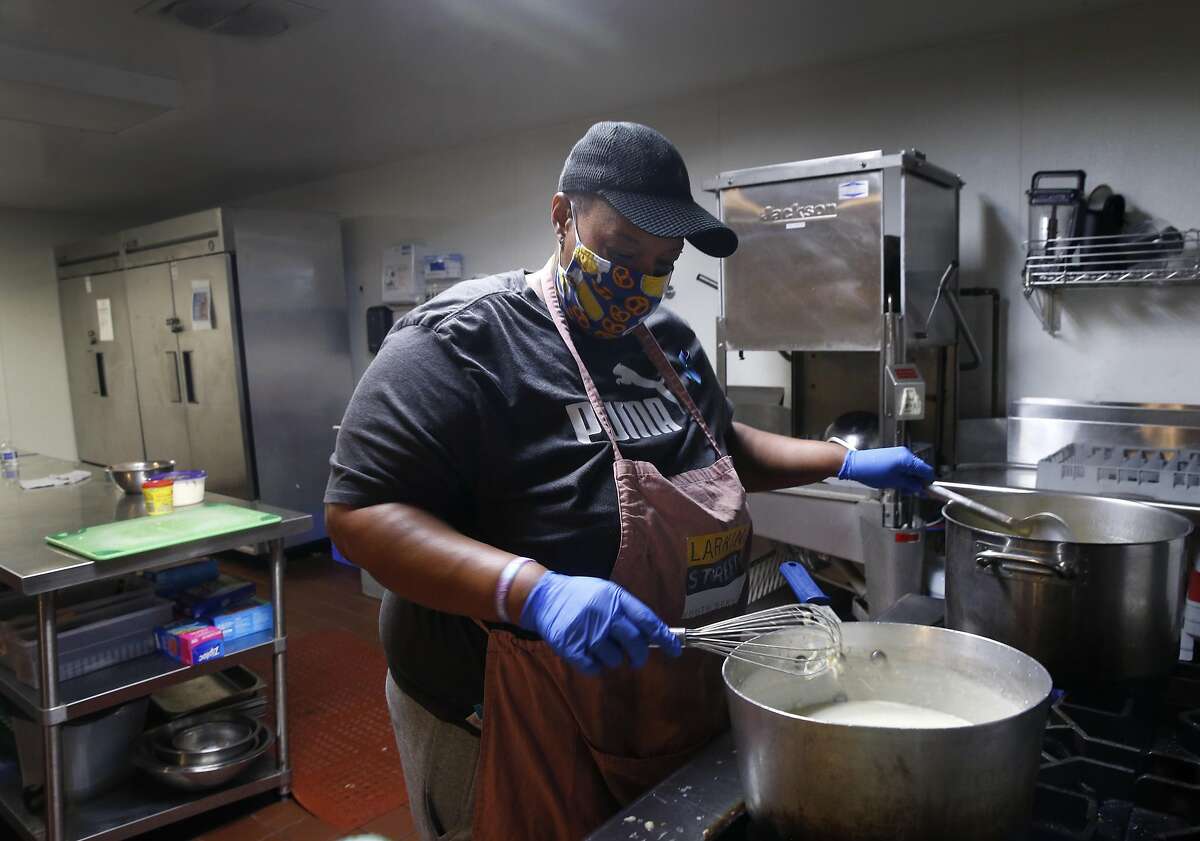 Tinya Sherrill prepares lunch at Larkin Street Youth Services in the Tenderloin in San Francisco, Calif. on Wednesday, Sept. 9, 2020. The center's future could be in doubt if a number of measures on the November ballot are rejected by voters.