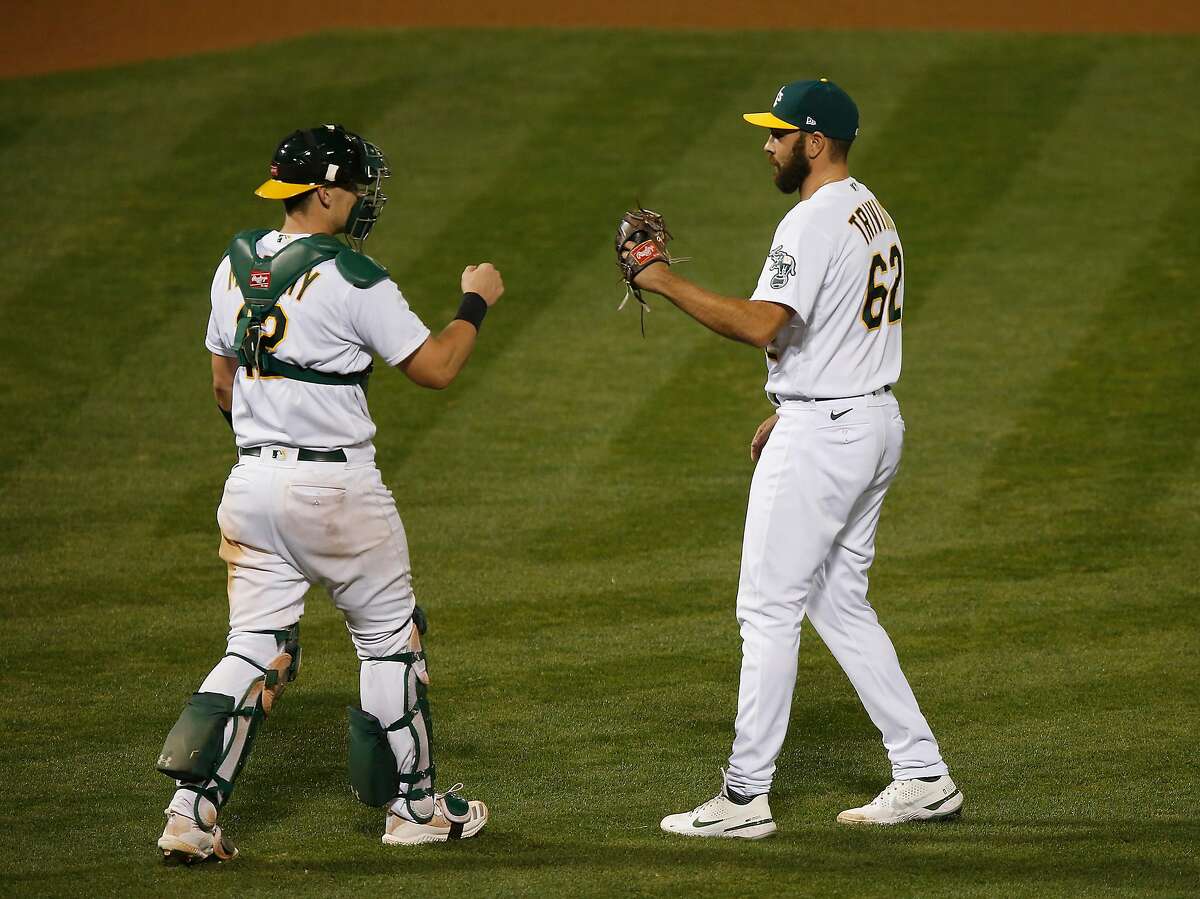 OAKLAND, CALIFORNIA - SEPTEMBER 07: Closing pitcher Lou Trivino #62 of the Oakland Athletics celebrates with catcher Sean Murphy #12 after a win against the Houston Astros at Oakland-Alameda County Coliseum on September 07, 2020 in Oakland, California. (Photo by Lachlan Cunningham/Getty Images)