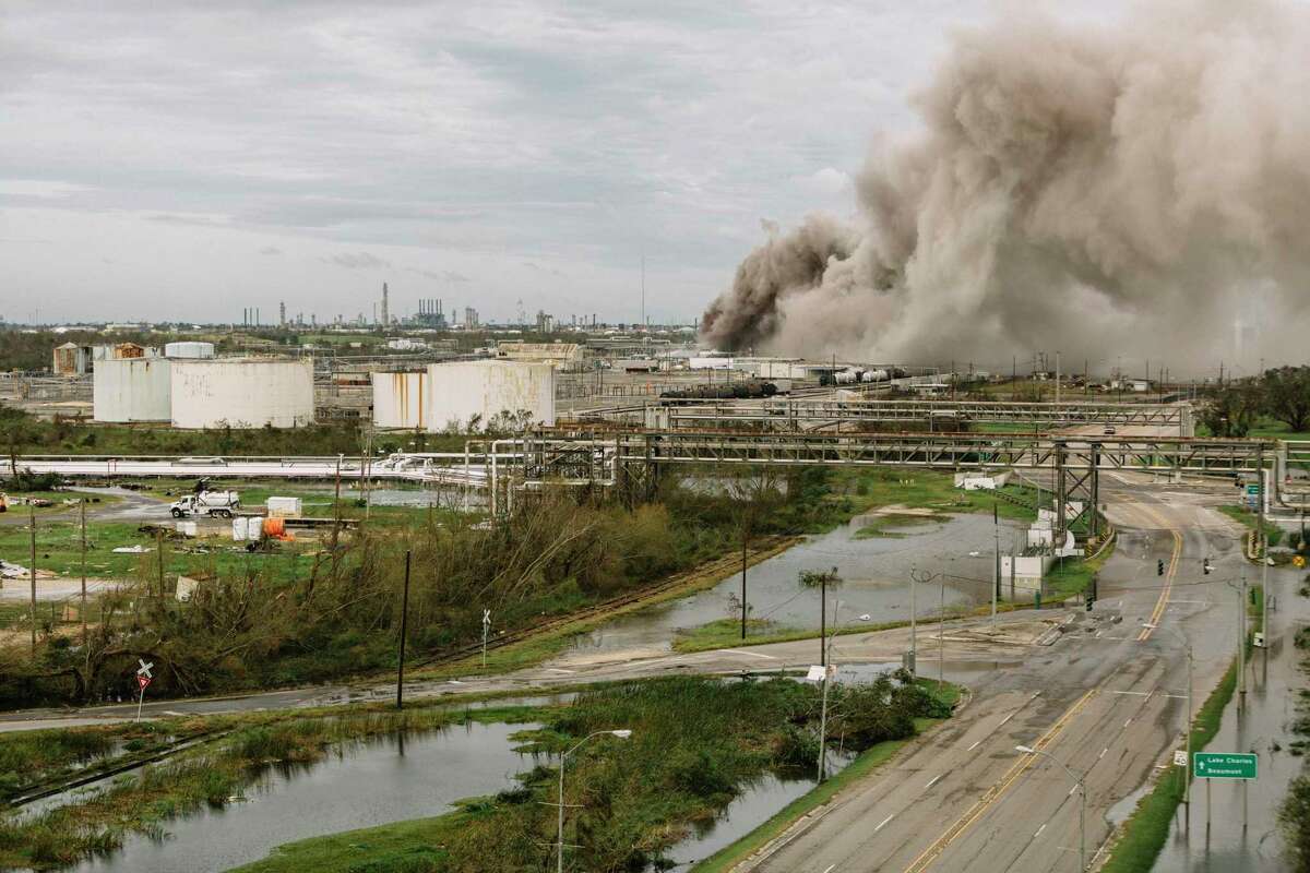 A fire burns at a BioLab industrial site in Westlake, La., near Lake Charles, on Thursday, Aug. 27, 2020, after Hurricane Laura passed through the region. The hurricane struck a coast studded with oil, gas and chemical plants. Previous storms have released a toxic mix of pollution, often affecting minority communities. (William Widmer/The New York Times)