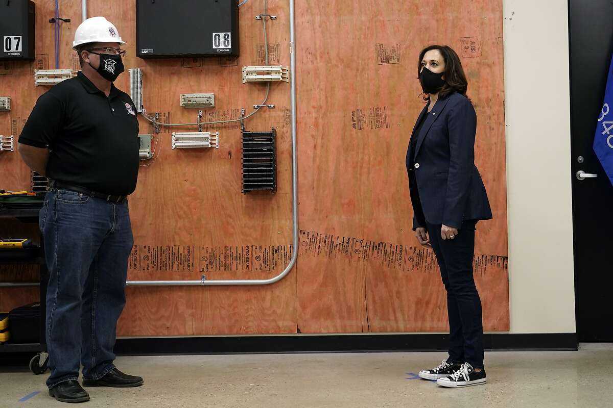 Democratic vice presidential candidate Sen. Kamala Harris, D-Calif., listens during a tour of the IBEW 494 training facility Monday, Sept. 7, 2020, in Milwaukee. (AP Photo/Morry Gash)