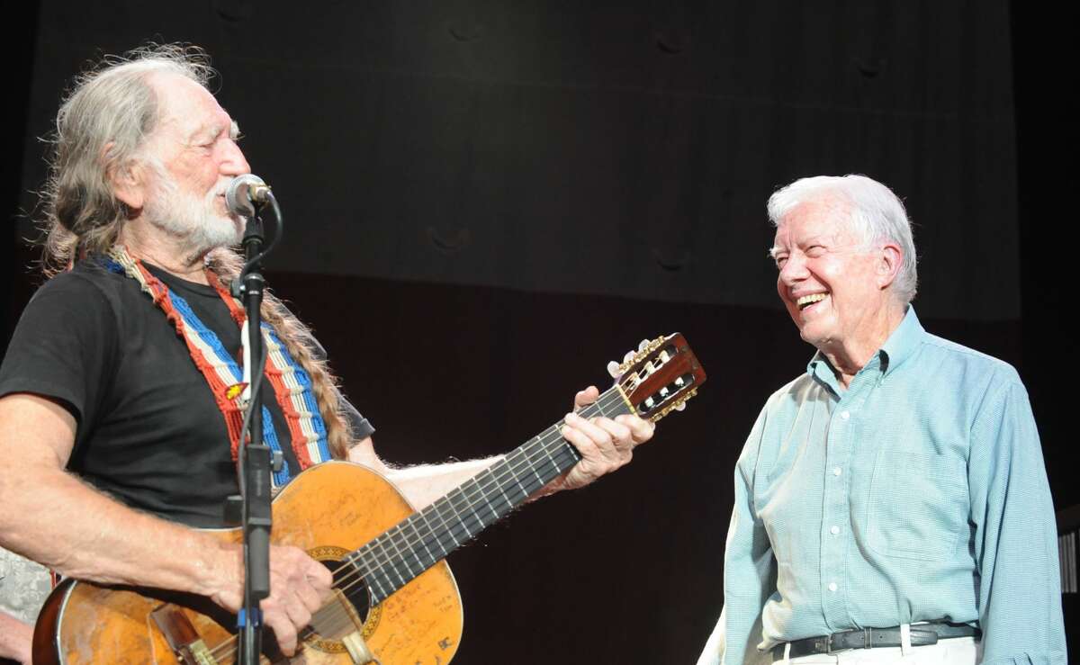 ***EXCLUSIVE COVERAGE*** Willie Nelson is joined on stage by former President Jimmy Carter, who played harmonica on "Georgia on My Mind," at Chastain Park Amphitheater on July 27, 2008 in Atlanta, Georgia. Nelson and the former President are longtime f
