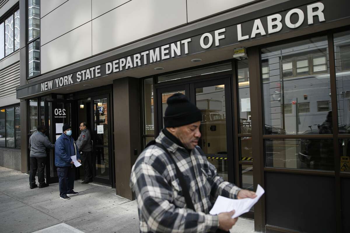 The Department of Labor declined to provide a figure on how many New Yorkers have pending unemployment claims, stating only that "all applications three weeks or older have been processed." In this March 18, 2020 file photo, visitors to the Department of Labor are turned away at the door by personnel due to closures over coronavirus concerns in New York. (AP Photo/John Minchillo, File)