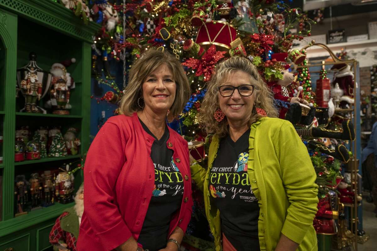 Miss Cayce's Wonderland co-owners Becky McCraney, left, and Kathy Harrison, right, pose in front of the Nutcracker tree in this file photo.
