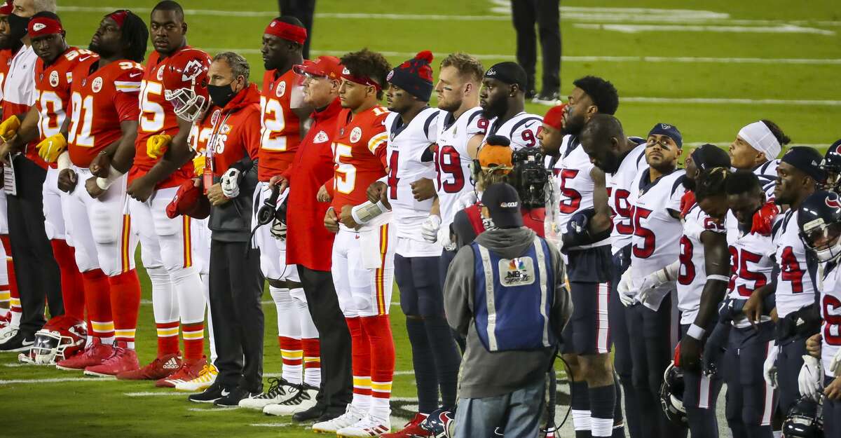 The Houston Texans and Kansas City Chiefs line up together on the field before the start of an NFL football game on Thursday, Sept. 10, 2020, at Arrowhead Stadium in Kansas City.