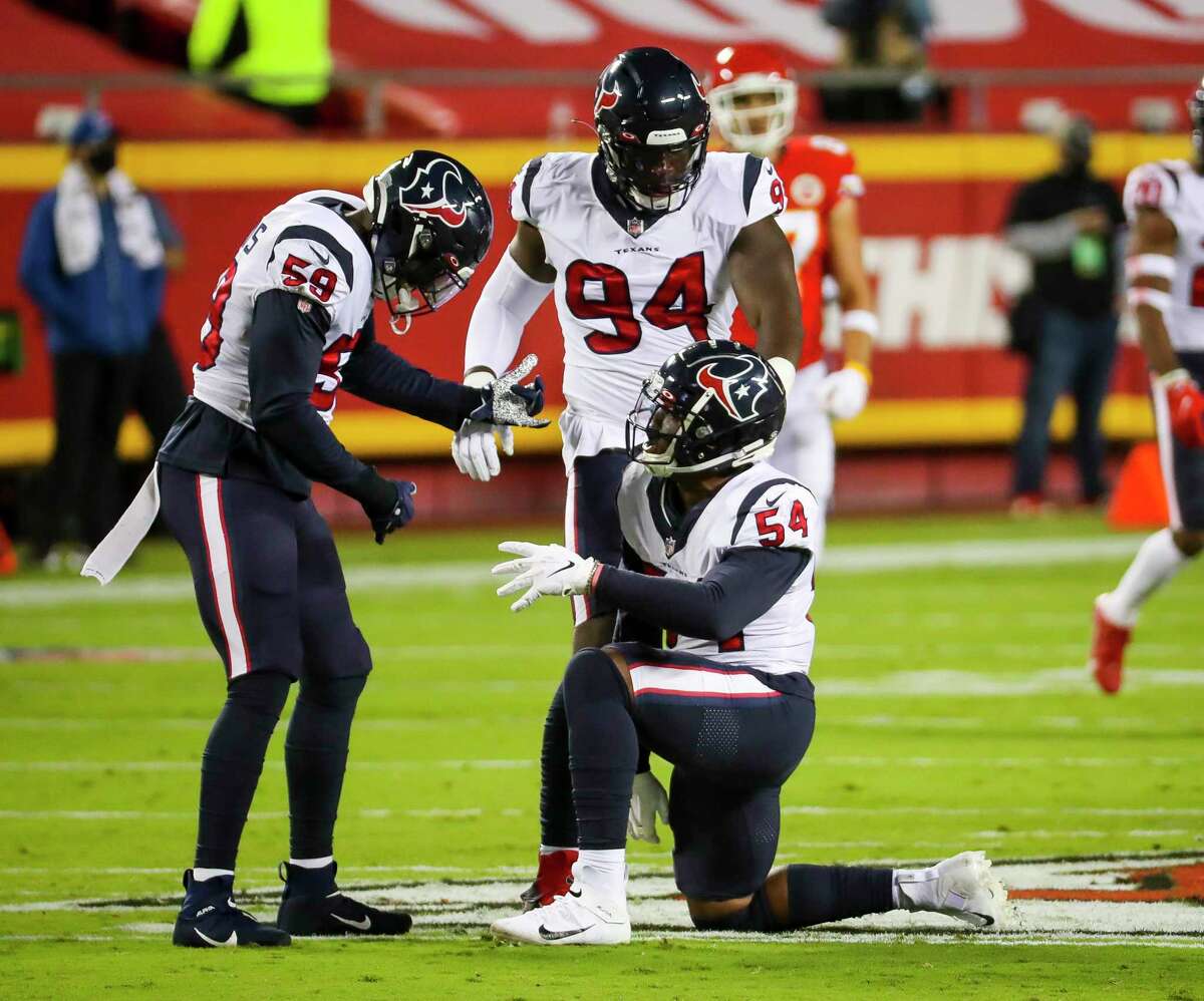 Houston Texans linebacker Jacob Martin (54) celebrates his sack of Kansas City Chiefs quarterback Patrick Mahomes (15) with linebacker Whitney Mercilus (59) and defensive end Charles Omenihu (94) during the first quarter of an NFL football game on Thursday, Sept. 10, 2020, at Arrowhead Stadium in Kansas City.