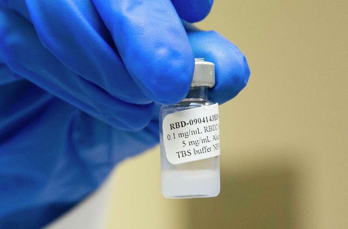 Maria Bottazzi, co-director of Texas Children's Hospitals Center for Vaccine Development, holds a vial of vaccine for COVID-19 that is developed in the lab. The lab has been working to develop vaccine for COVID-19 with yeast.