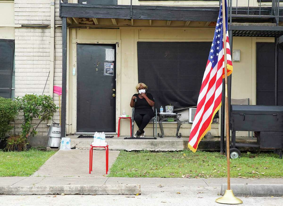 Judy Phillips, waits outside her apartment for a press conference with U.S. Rep. Sheila Jackson Lee at Spanish Village Apartments in Houston on Tuesday, Sept. 8, 2020. Phillips, who has cancer, was scheduled to be evicted today, but was able to stay with the help of Rep. Jackson Lee.