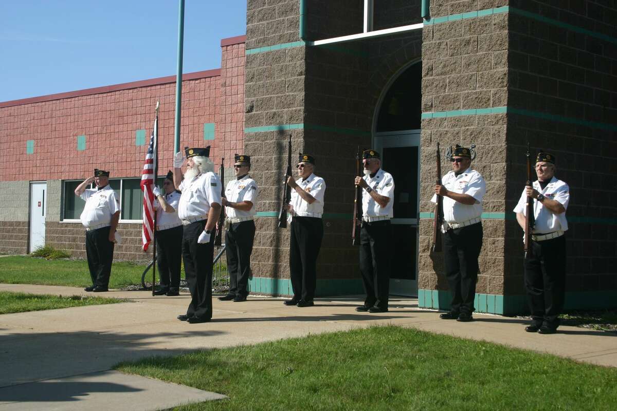 The Big Rapids American Legion Post 98 Honor Guard paid tribute to the victims of 9/11 at a ceremony, Friday, at the 9/11 memorial on the grounds of the Big Rapids Police Department and Fire station.