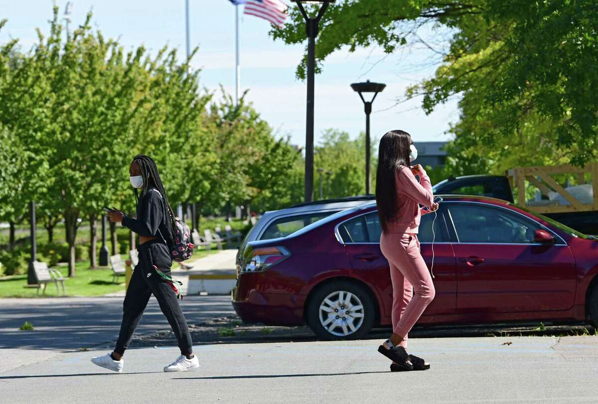 Students are seen walking to and from Colonial Quad dormitory at University at Albany on Friday, Sept. 11, 2020 in Albany, N.Y. (Lori Van Buren/Times Union)