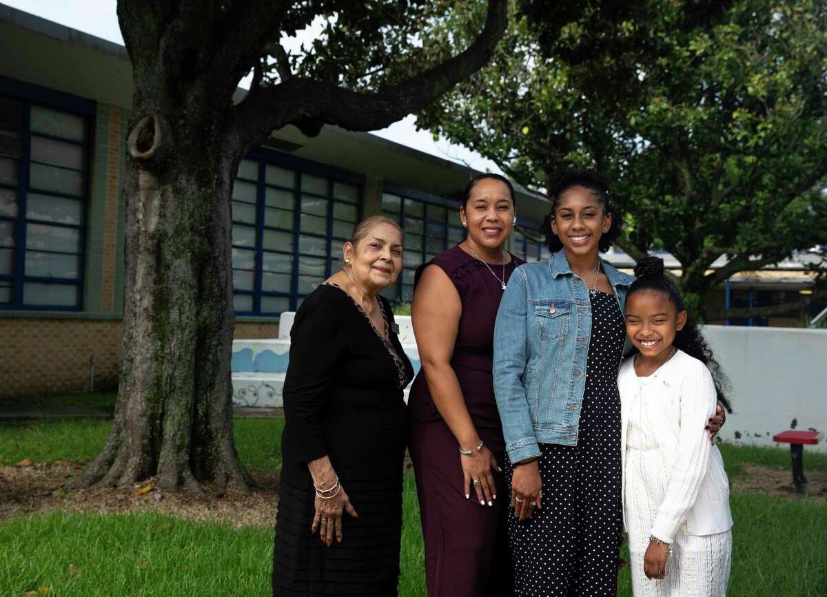 Burnell Loche, 66, poses for a photograph with her daughter, Edwina Loche Barrett, 42, and granddaughters, Eryn Levy, 16, and Parker Barrett, 9, Friday, Sept. 11, 2020, at Betsy Ross Elementary School in Houston. Loche was one of 12 Black students to first attend previously all-white campuses in 1960 when desegregation began in Houston ISD, enrolling in Betsy Ross Elementary School. The experience shaped Loche's views on education and integration, an ethos now passed down to the generations.