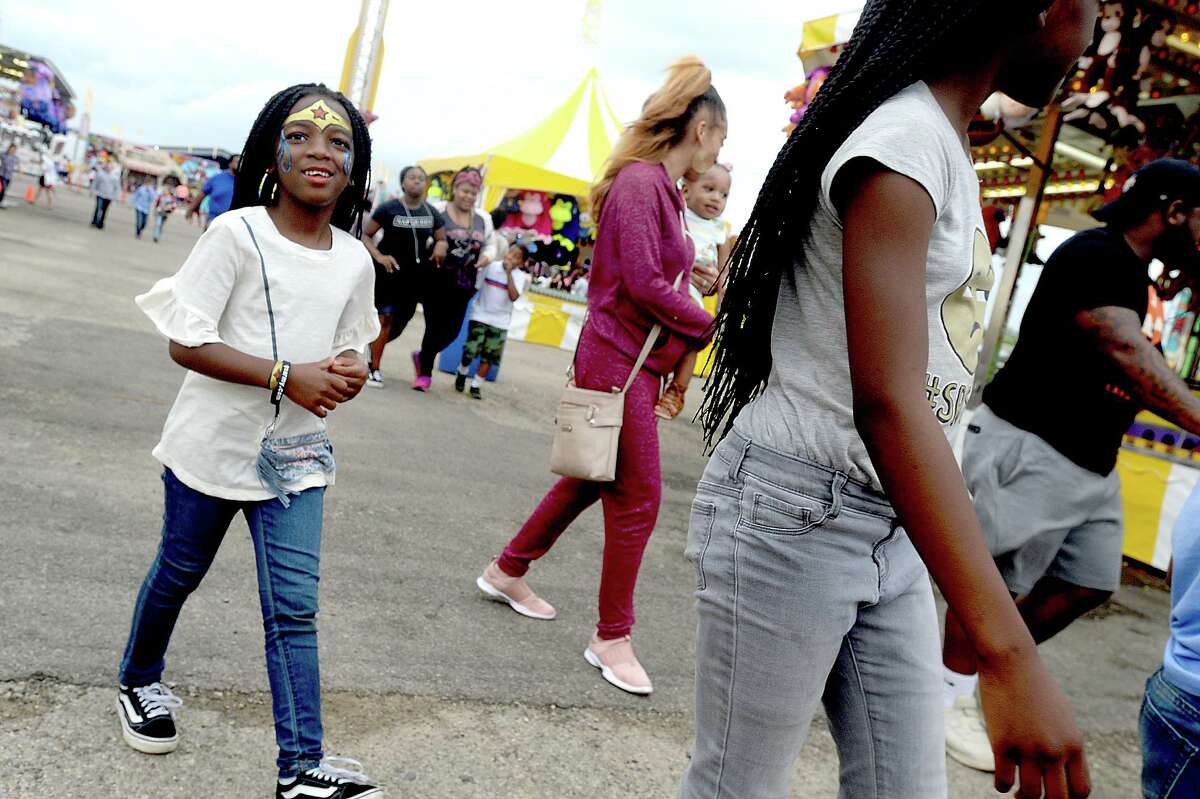 Carnival-goers enjoy the South Texas State Fair Saturday. Sunday marks the final day of this year's fair, with gates opening at noon and closing at 8 p.m. or later depending upon attendance. Photo taken Saturday, March 30, 2019 Kim Brent/The Enterprise