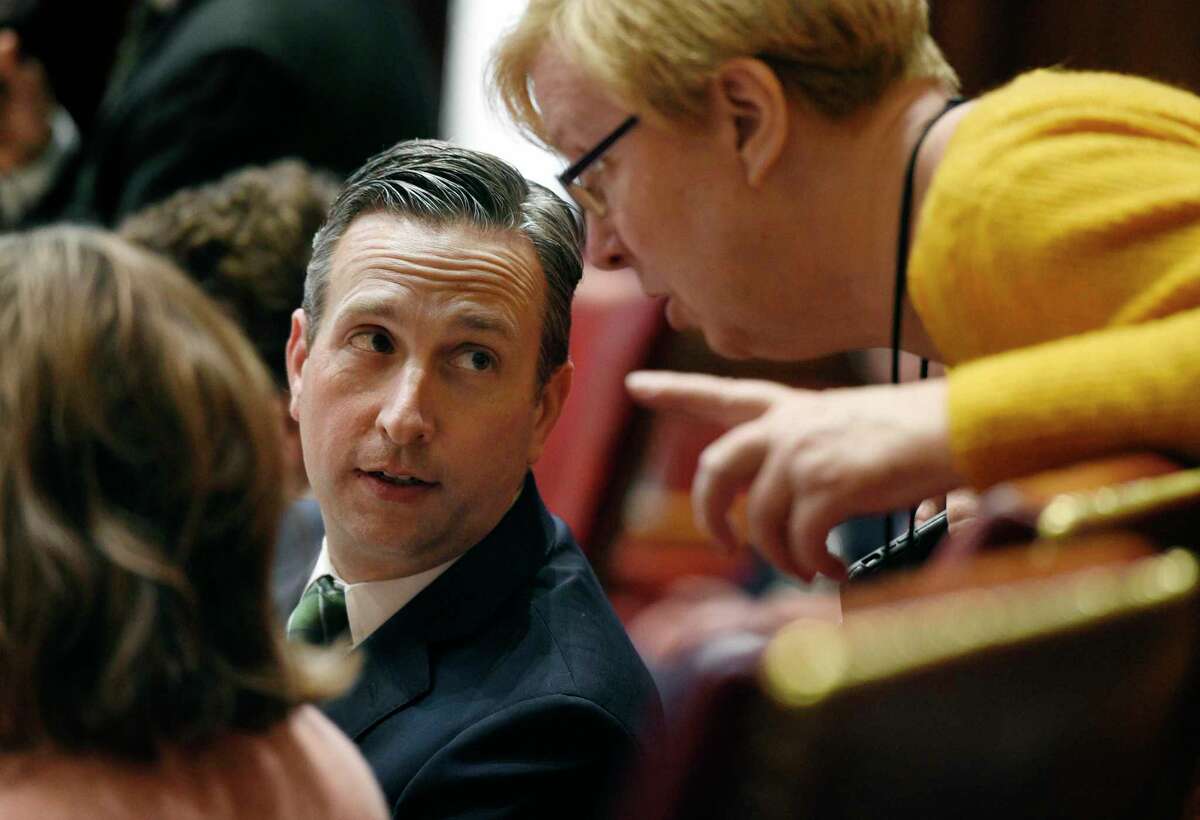 FILE- In this Dec. 18, 2019, file photo, Connecticut Senate Majority Leader Bob Duff, D-Norwalk, left, talks with state Sen. Cathy Osten, D-Sprague, during a special session at the State Capitol in Hartford, Conn. Connecticut State Capitol Police say they have been sending patrols to Duff's Norwalk, Conn., home in response to Duff's claims that Norwalk police officers tried to intimidate him. Capitol police said Thursday, Sept. 3, 2020, that the patrols are just a precaution.(AP Photo/Jessica Hill File)