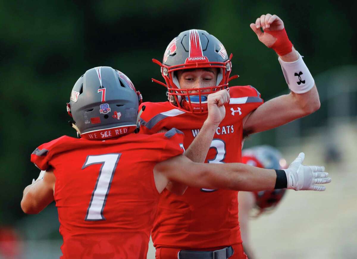 Splendora wide receiver Nick Johnson (7) celebrates with quarterback Jagger Kennedy (5) after connecting on a 5-yard touchdown pass during the first quarter of a non-district high school football game at Wildcat Stadium, Friday, Sept. 11, 2020, in Splendora.