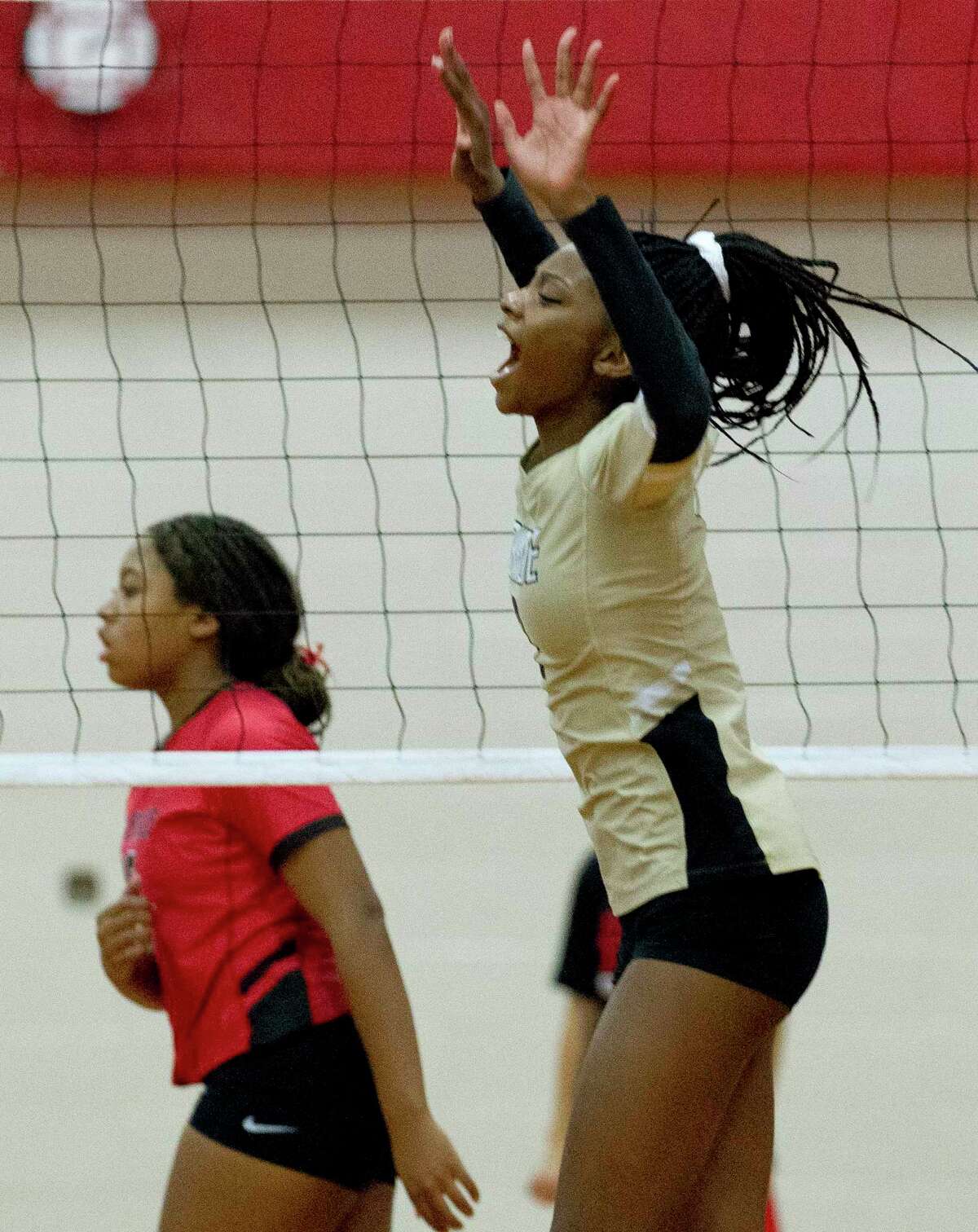 Conroe middle blocker Mikayla Anderson (2) reacts after a block during the first set of a District 15-6A high school volleyball match at Oak Ridge High School, Friday, Sept. 27, 2019, in Oak Ridge.