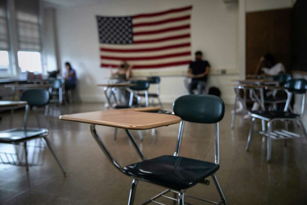 Students attend a socially-distanced class on the first day of school at Stamford High School on Sept. 8.