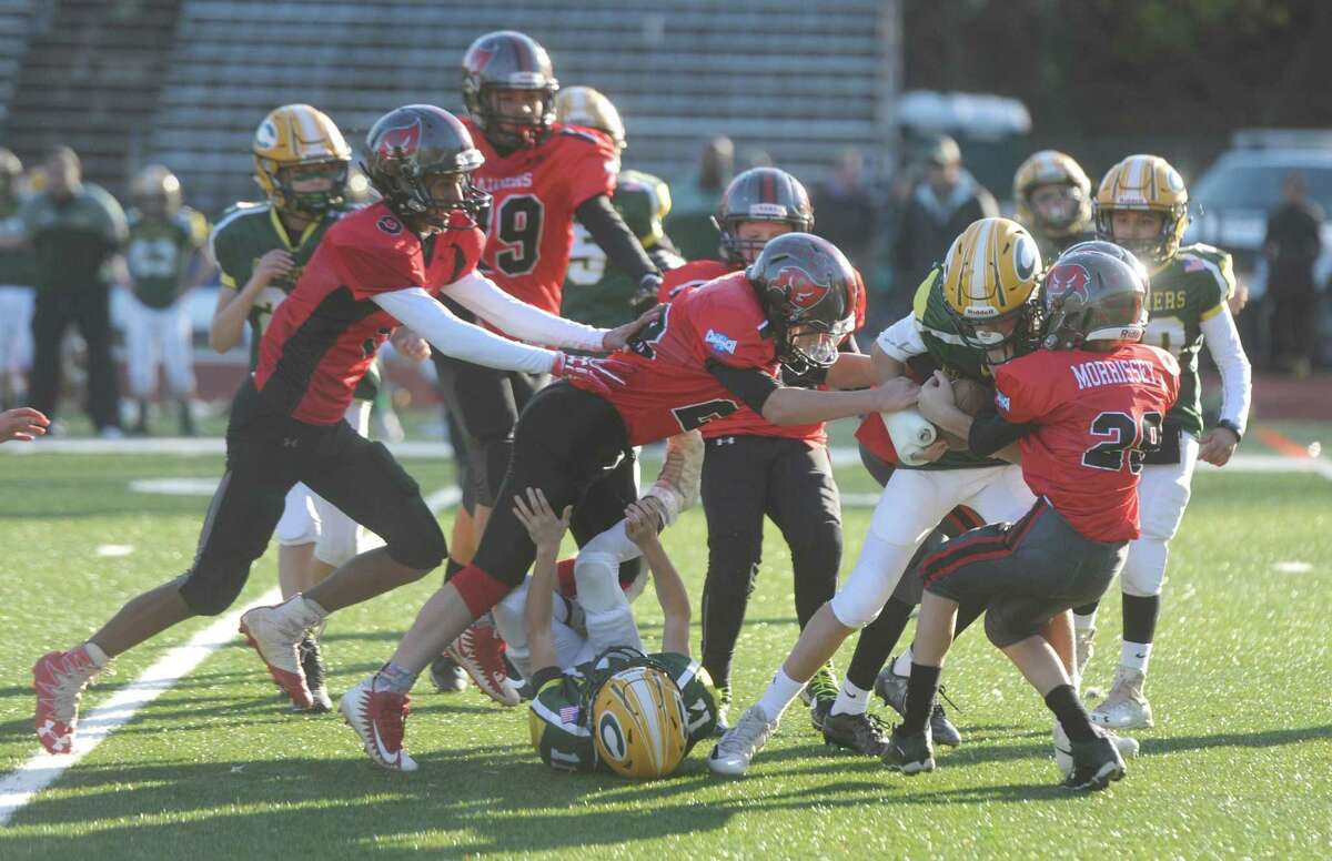 The hope is that the Greenwich Youth Football League, seen here in a 2017 playoff game between the BANC Raiders and Cos Cob Crushers, will be able to proceed as normal but with an eye on the coronavirus no final decisions have been made. Some form of football will be played this year but the league is closely watching circumstances before officially deciding which direction to go in.