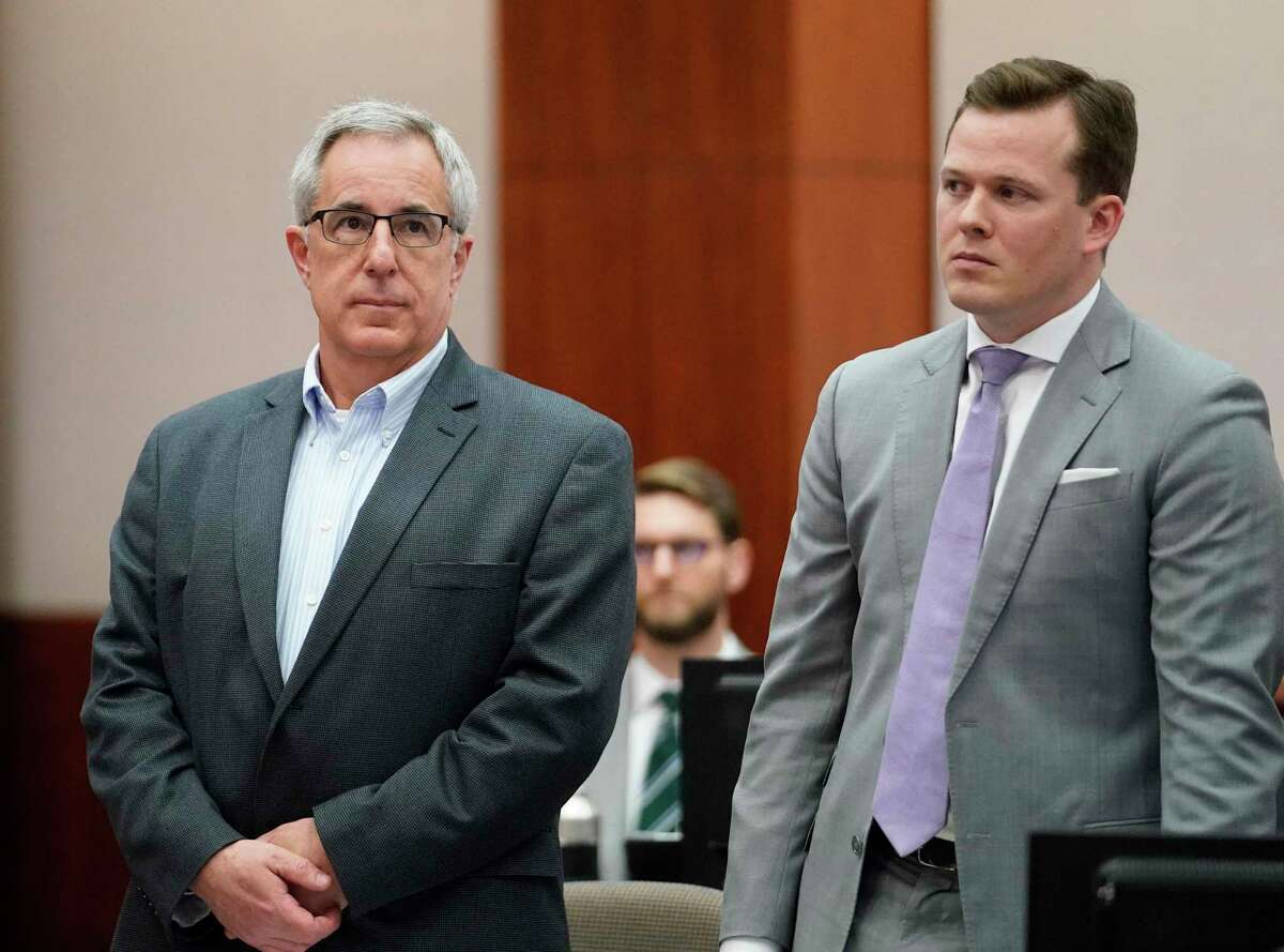 Michael Keough, retired vice president of Arkema Inc., left, and his defense attorney Cordt Akers, right, are shown during the Arkema Inc. criminal trial at Harris County Criminal Courthouse, Monday, March 2, 2020, in Houston. Arkema Inc., a subsidiary of a French chemical manufacturer, along with three senior staff members are on trial over a fire at the Crosby chemical plant that was overwhelmed by Hurricane Harvey's flooding in 2017.