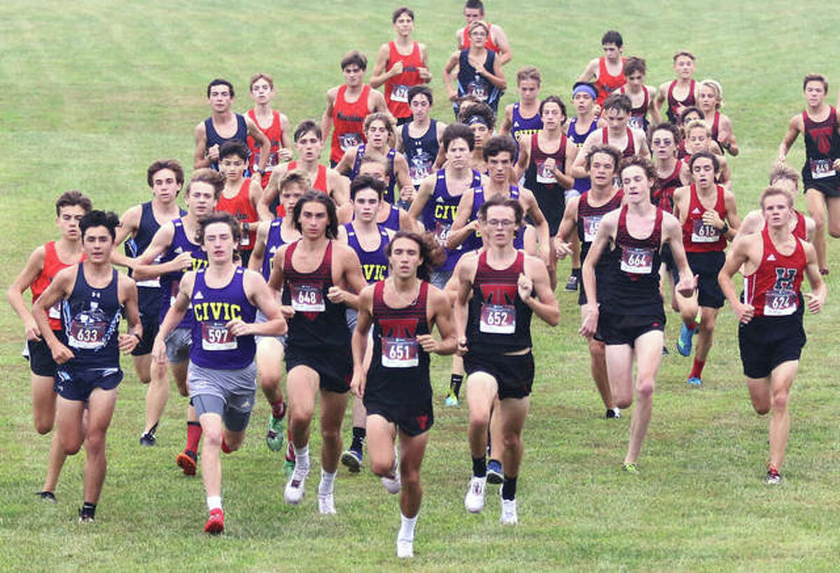 The Pre-MVC Meet boys field of 50 breaks from the start and heads for the first of two steep inclines of about 15 yards on Saturday morning at Triad High School in Troy.