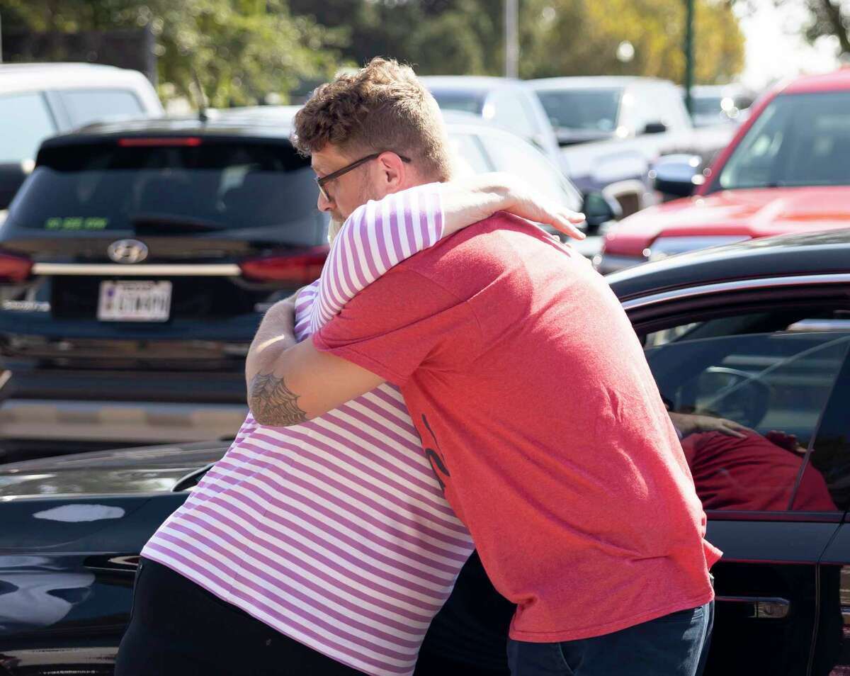 Linda Asteris and Nick Moffitt embrace one another at Honor’s Café in Conroe, Saturday, Sept. 12, 2020. The Asteris’s donated their vehicle to the organization after their son passed away and wanted to give their vehicle to a veteran.