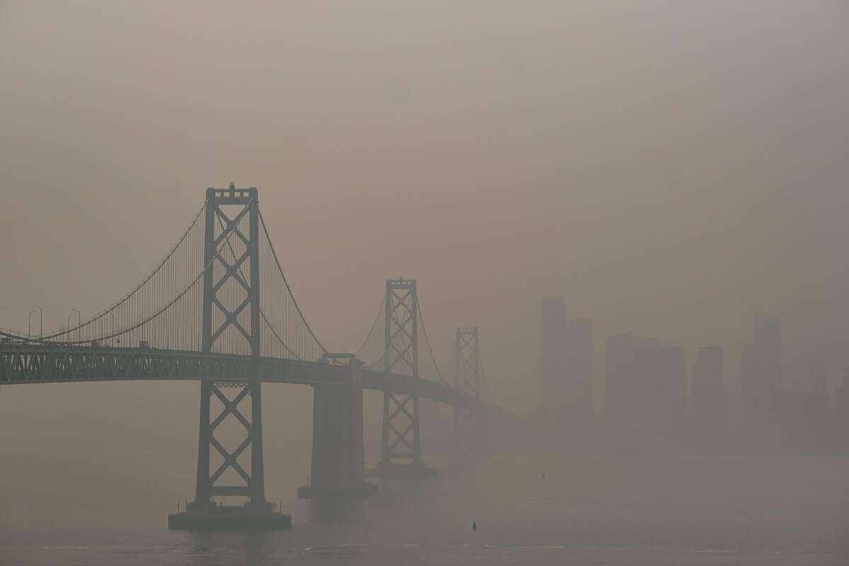 The Bay Bridge and San Francisco skyline are barely visible through the hazy, smoke-filled air in September.