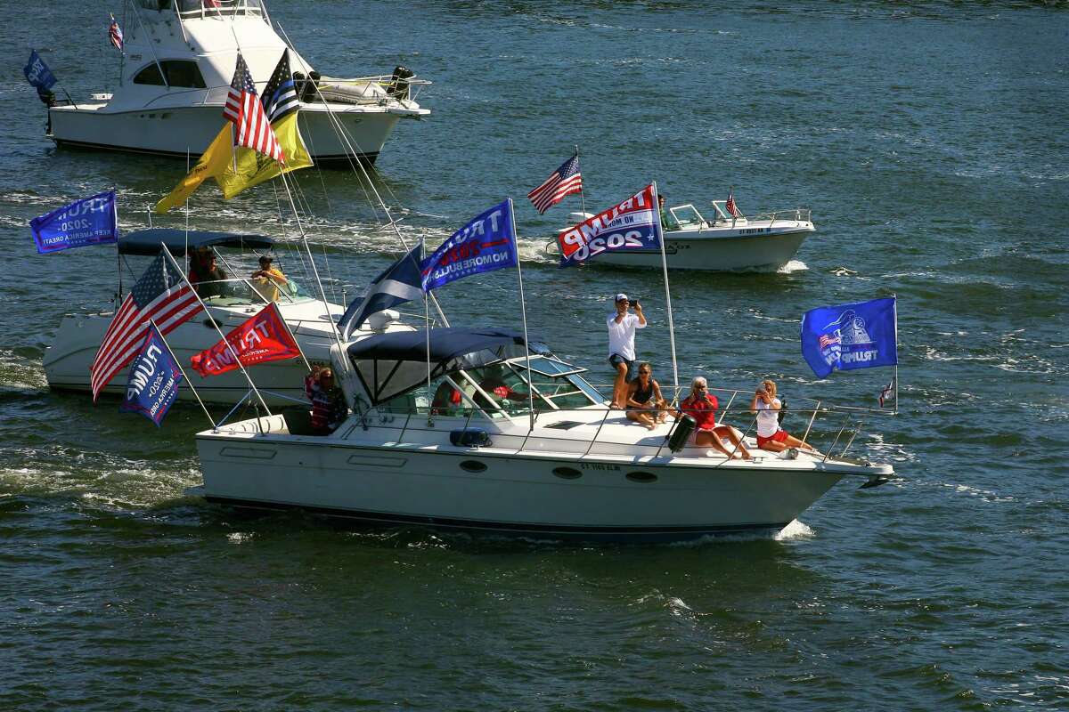 Supporters of President Trump take part in a boat parade on the Housatonic River in Stratford, Conn., on Saturday Sept. 12, 2020. The public Facebook event page titled “Trump And Blue Lives Matter Boat Parade” listed Stratford lighthouse, New Haven harbor, Charles Island and Devon Bridge between Stratford and Milford as way-points. Hundreds of motorists also took part in a simultaneous car parade which started in Seymour and ended at The Dock shopping center in Stratford.