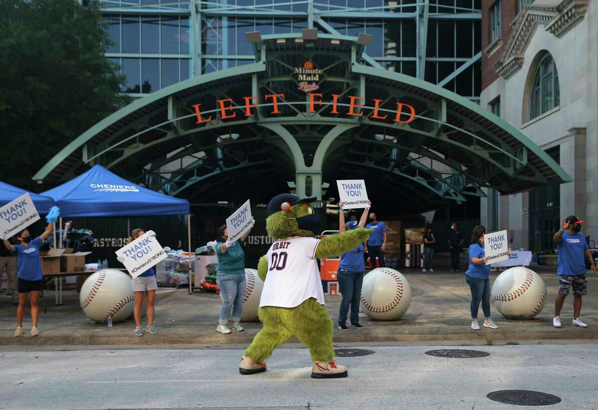 Houston Astros Mascot Orbit helps to direct the traffic during an emergency supplies drive for communities in the Lake Charles, La., area that were impacted by Hurricane Laura Saturday, Sept. 12, 2020, at Minute Maid Park in Houston.