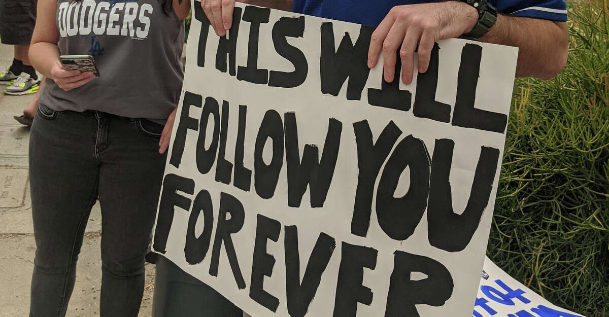A sign held by a Dodgers fan before the series against the visiting Astros.