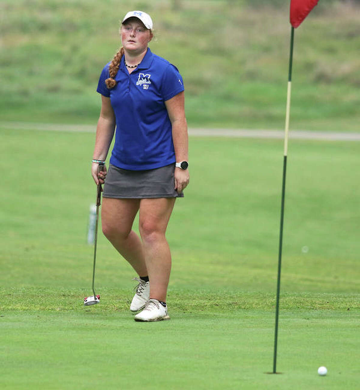 Marquette’s Gracie Piar reacts after missing a putt on the 18th hole Saturday in the Alton Classic at Rolling Hills golf course in Godfrey. Piar finished fourth at 76.