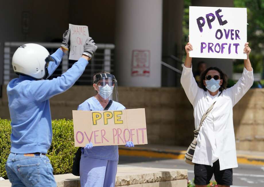 People protest protective equipment shortages on April 15 outside of CHI St. Luke’s in the Medical Center. COVID-19 quickly depleted the national stockpile and forced medical workers to ration key supplies, such as N95 respirators and face shields. Photo: Melissa Phillip, Staff Photographer / © 2020 Houston Chronicle