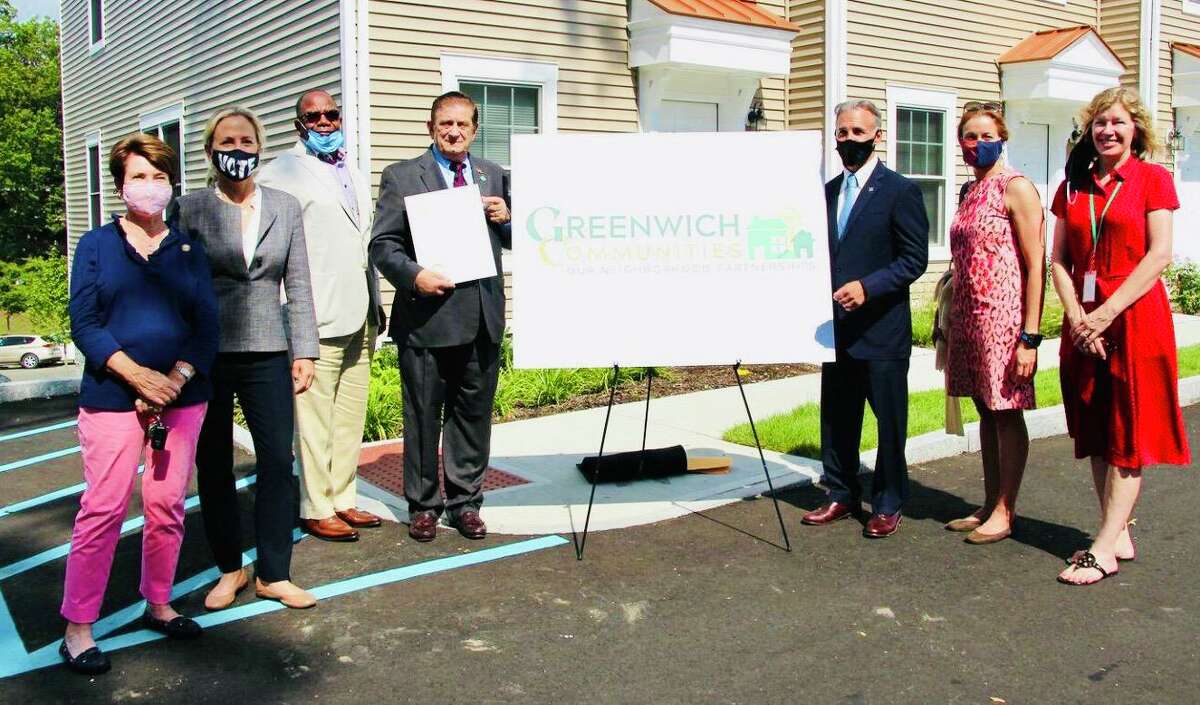 From left, state Rep. Livvy Floren, state Sen. Alex Kasser, Greenwich Communities Executive Director Anthony Johnson, Greenwich Communities Board of Commissioners Chair Sam Romeo, First Selectman Fred Camillo, Selectwoman Jill Oberlander and Selectwoman Lauren Rabin gather at the special ceremony officially changing the name of the Housing Authority of the Town of Greenwich to Greenwich Communities.