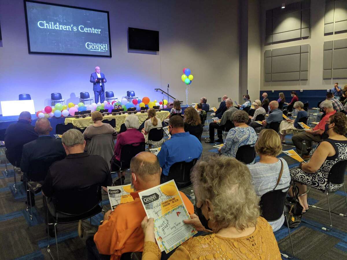 Pastor Jay Gross of West Conroe Baptist Church speaks to his congregation from the worship space in the new children’s building. The church celebrated the ribbon cutting of its new children's building on Sunday, Sept. 13. The project was completed early and under budget.