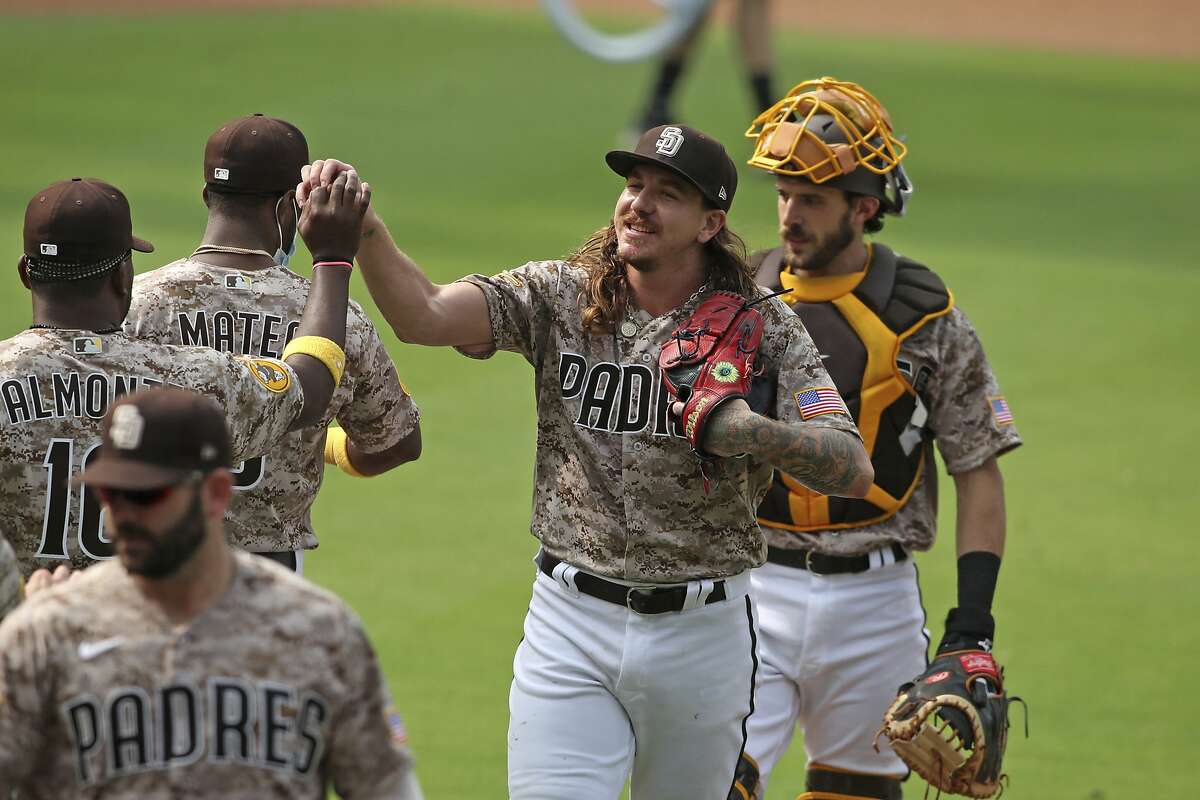 The San Diego Padres' Manny Machado is congratulated by teammate