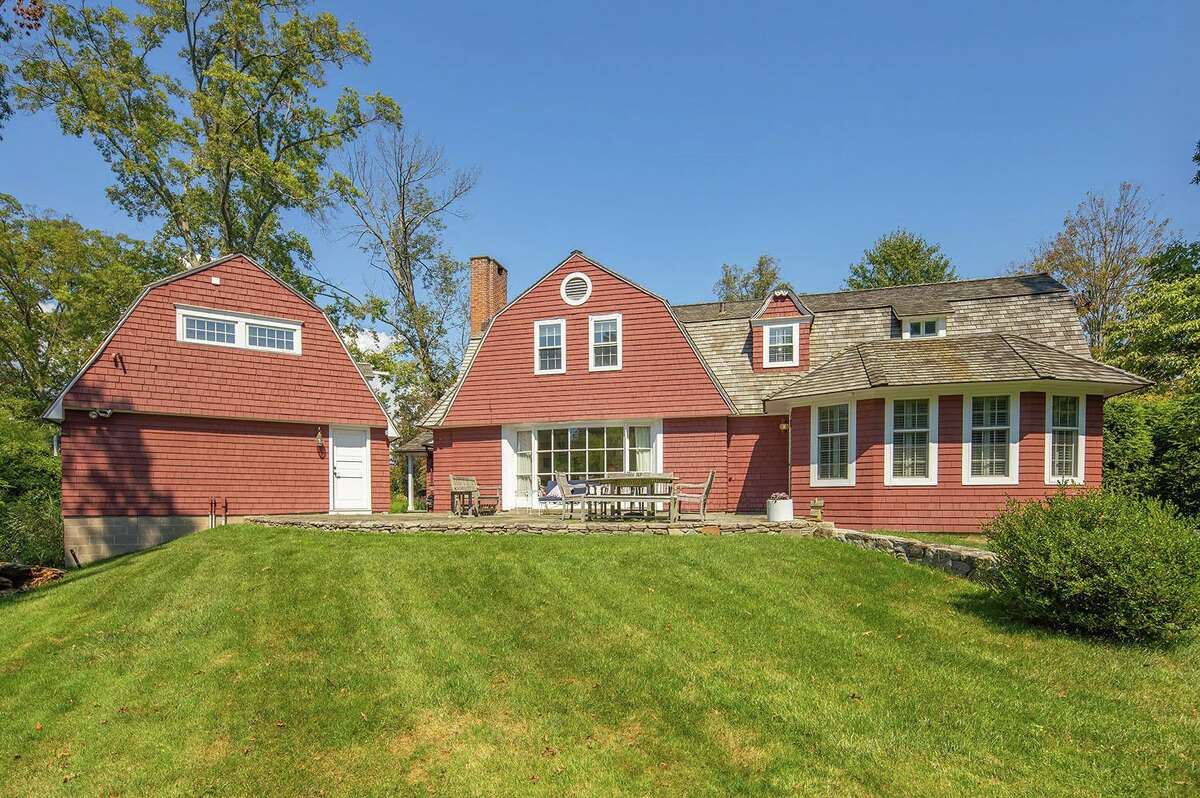 Off the back of the house and the detached two-car garage there is a stone patio. This eight-room, 2,806-square-foot house is within easy walking distance of the Southport train station just over a block away, Southport Harbor, Pequot Yacht Club, Southport Beach, and the Village shops and eateries. Only a few steps away is the local