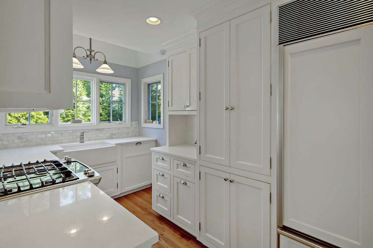 The kitchen features a farm sink, stone counters and high-end appliances. Although the historic library is only offering curbside pickup and Zoom programming at the moment, eventually it will be back to offering its full complement of community events, art exhibits, lawn games, movie nights, twice-yearly large scale book sales, concerts, lectures, and holiday gatherings including the annual Fourth of July bicycle parade.