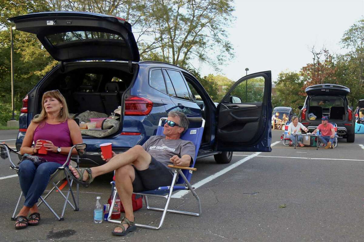 Jane and Brad Purcell of Fairfield relax before the show at the Terrapin concert from the Supper & Soul series at the Imperial Lot on Friday, Sept. 11, 2020, in Westport, Conn. "We're so excited," he said, before the show, which was sold out in a matter of minutes. Organized by the Westport-Weston Chamber of Commerce and held in cooperation with The Westport Library, the Supper & Soul series is a chance to combine good live music with a local dining experience.