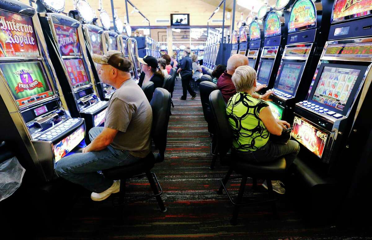Gamers occupy a row of machines at Naskila Entertainment in Livingston, Texas on Tuesday, June 7, 2016. The Alabama Coushatta Indian Tribe in Livingston - about an hour north of Houston - reopened its casino after a 14-year closure prompted by threats from the state of Texas to take legal action against the tribe. Recent legal developments paved the way for the reopening. Only "bingo" type machines are in use at Naskila Entertainment according to officials. (Kin Man Hui/San Antonio Express-News)
