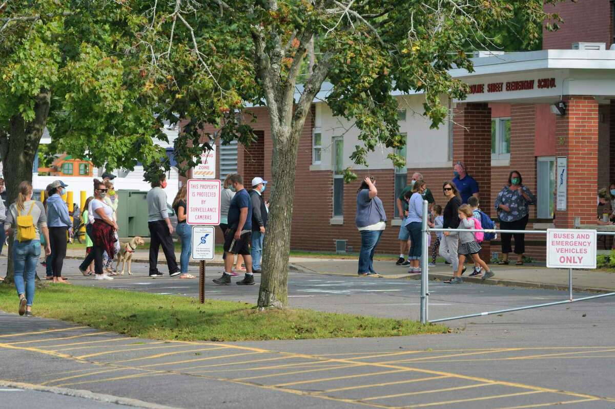 Parents line up to collect their children at the end of the school day at the Caroline Street School on Monday, Sept. 14, 2020, in Saratoga Springs, N.Y. (Paul Buckowski/Times Union)