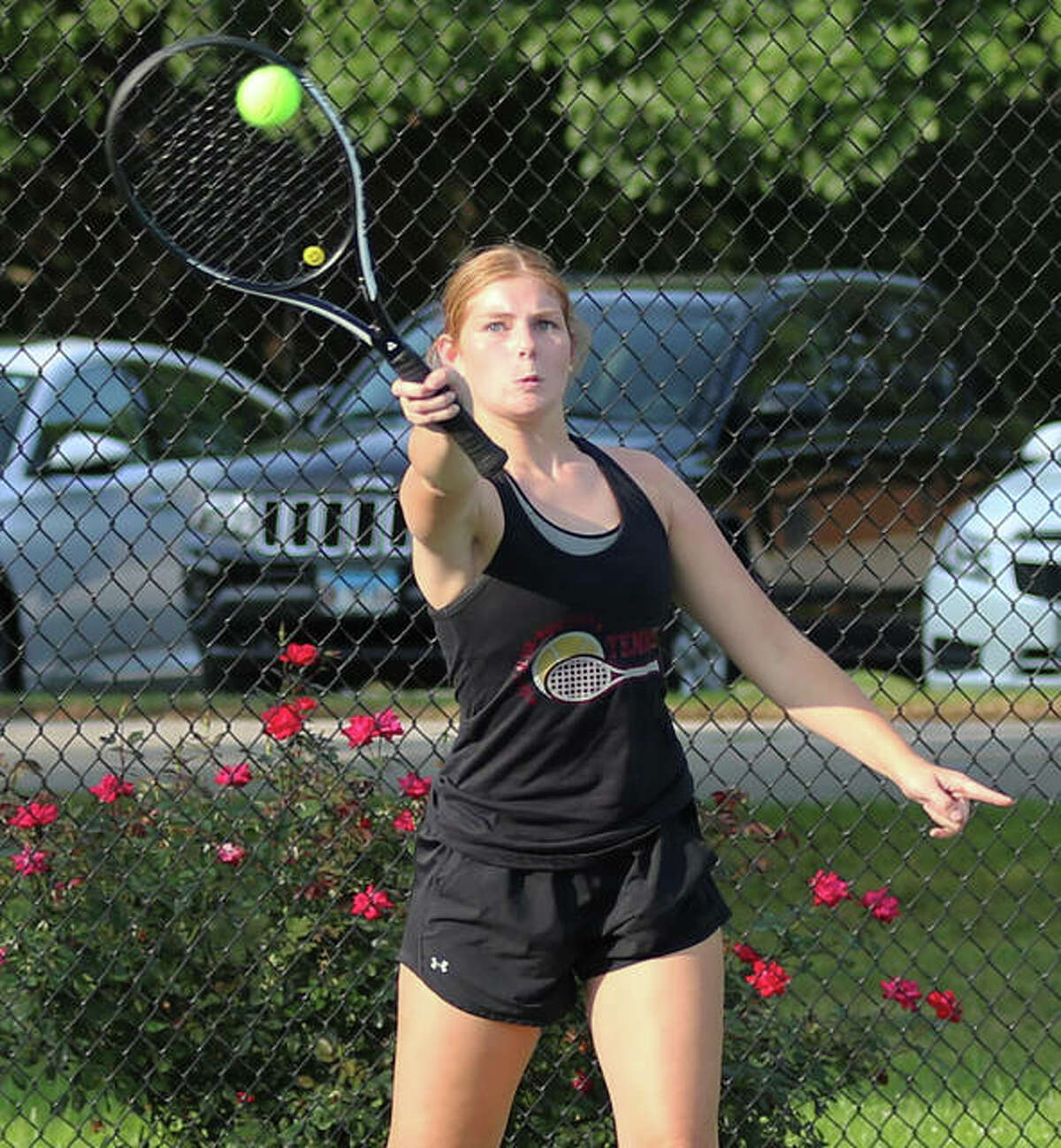 EA-WR’s Carli Withers hits a shot in double play against Marquette on Monday at Moore Park’s Simpson Tennis Center in Alton.