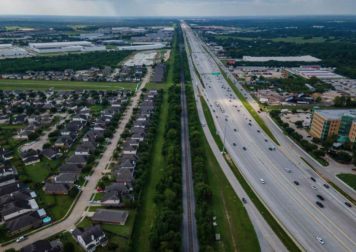 Traffic on U.S. 290 travels westward after its bend near Huffmeister Road on Sept. 11, 2020, in Houston. Train tracks run along U.S. 290 as well as Hempstead Road along the length of the highway. TxDOT is reviving plans for two elevated managed lanes in each direction along Hempstead, from Loop 610 to the Grand Parkway.