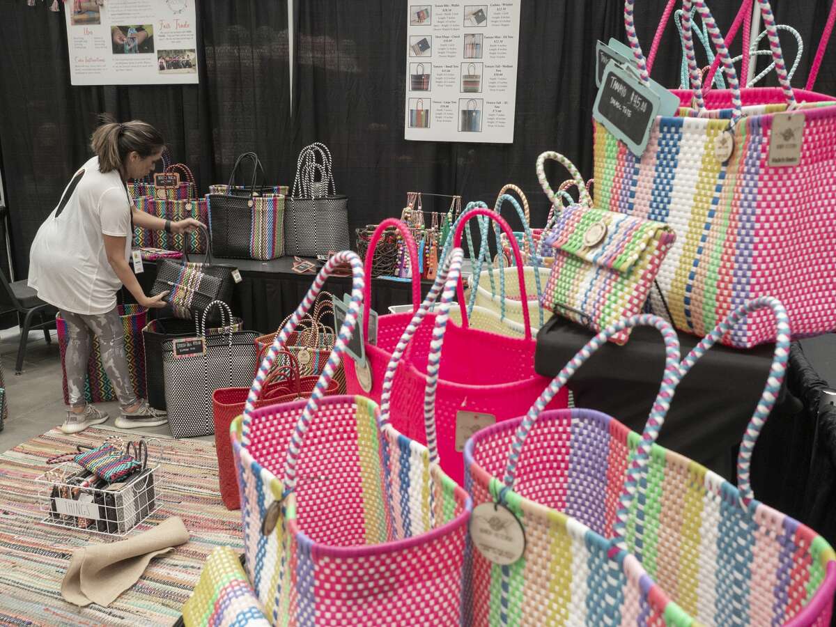 Marta Ruiz, from Midland, organizes her recycled PVC, hand woven bags from Mexico 09/15/2020 as she and others prepare their booths for the Pop Spot Market at the Bush Convention Center. Tim Fischer/Reporter-Telegram