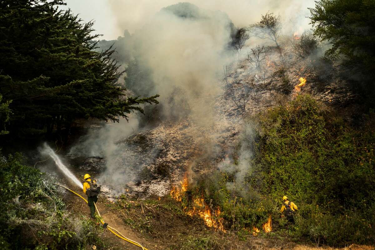 BIG SUR, CALIFORNIA - AUGUST 22, 2020: Battling the Dolan Fire along the central California coast, Los Padres National Forest fire fighters implement a "back-fire" method to burn off underbrush to protect residential structures in Big Sur, California on Saturday August 22, 2020. (Photo by Melina Mara/The Washington Post via Getty Images)